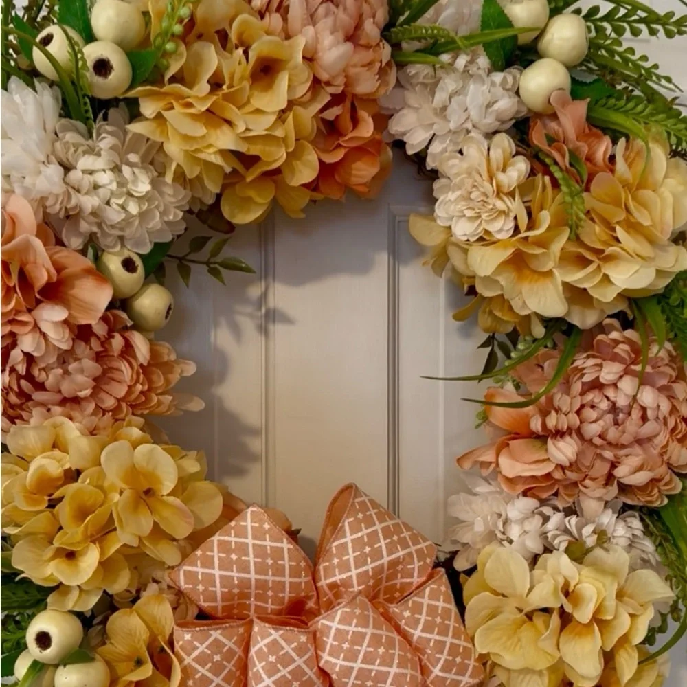 Elegant Floral Holiday Wreath with Peach and Cream Accents